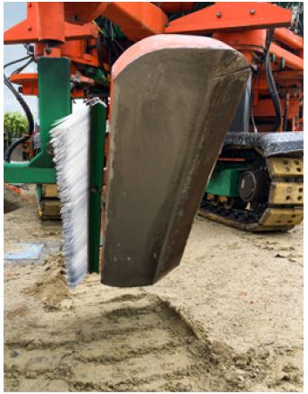 cepillo esparcir arena